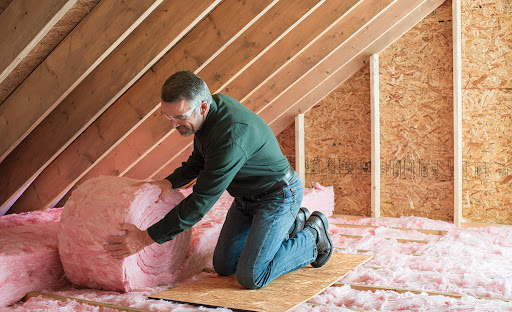 Staff working on replacing current insulation materials