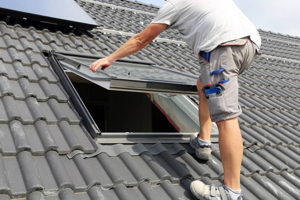 A staff member Installing a skylight