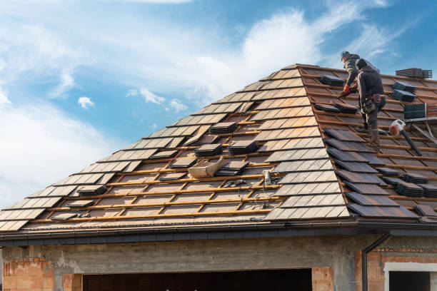 Roof repair specialist replacing damaged shingles on Sammamish home